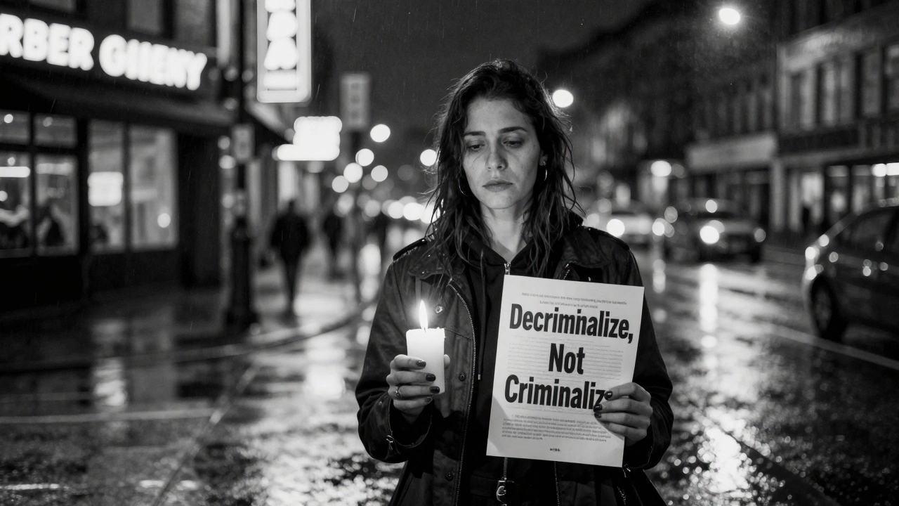 A lone sex worker holds a candle and flyer on a rainy city street at night.